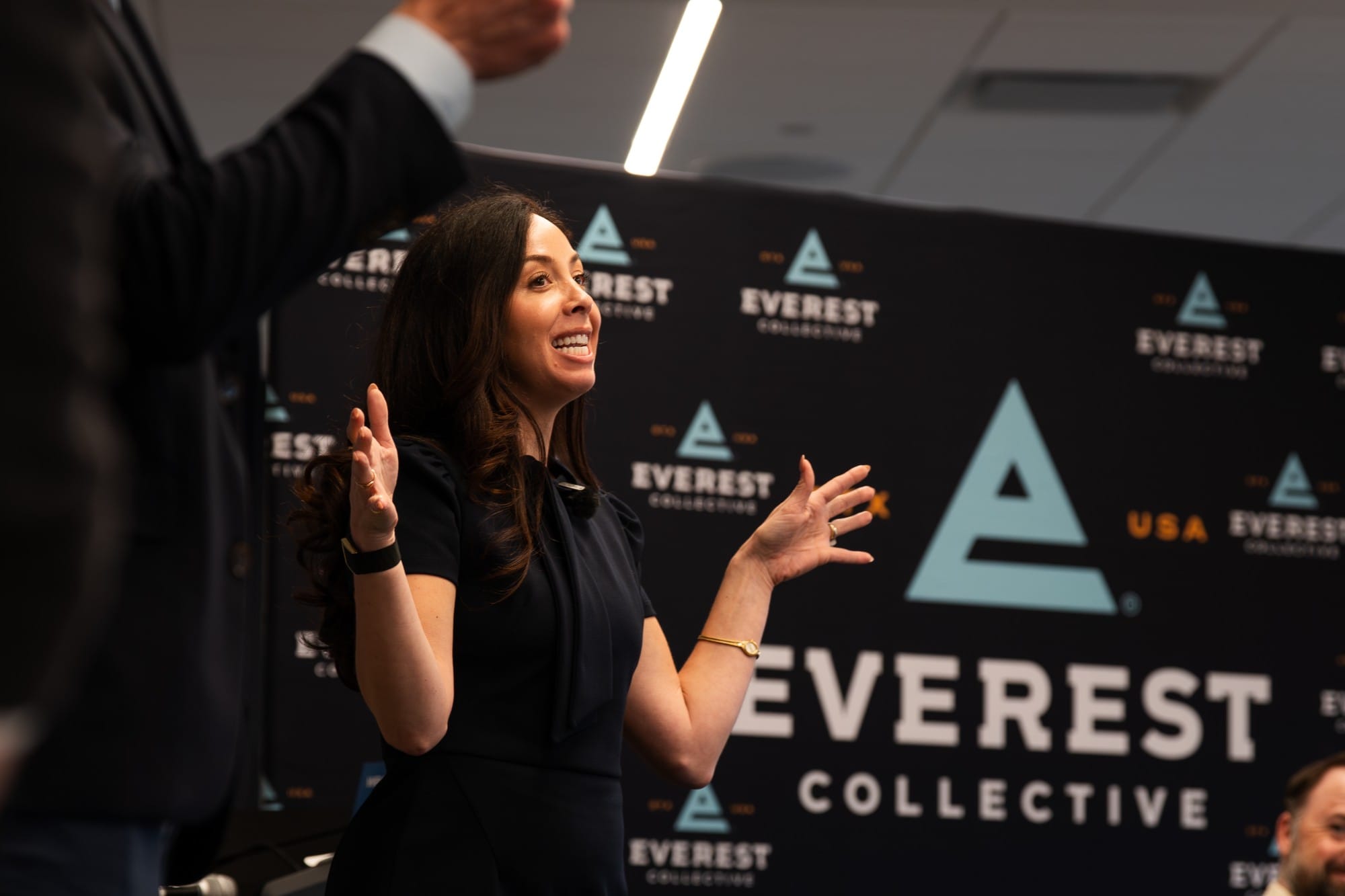 Brittany Tipton with leaders in front of the Everest Collective backdrop