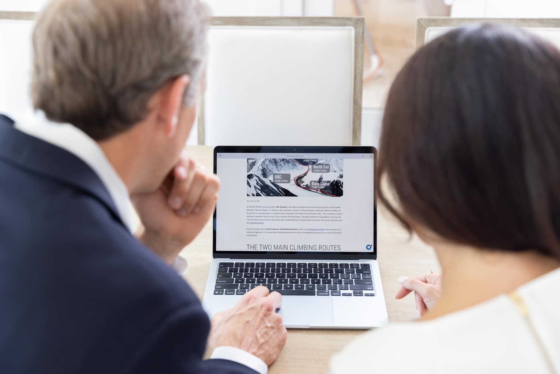 Mike Fromhold and Brittany Tipton looking at a laptop together