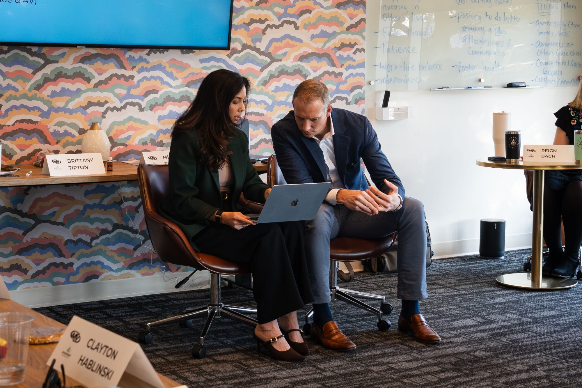 Mike Fromhold and Brittany Tipton reviewing a plan together on a laptop