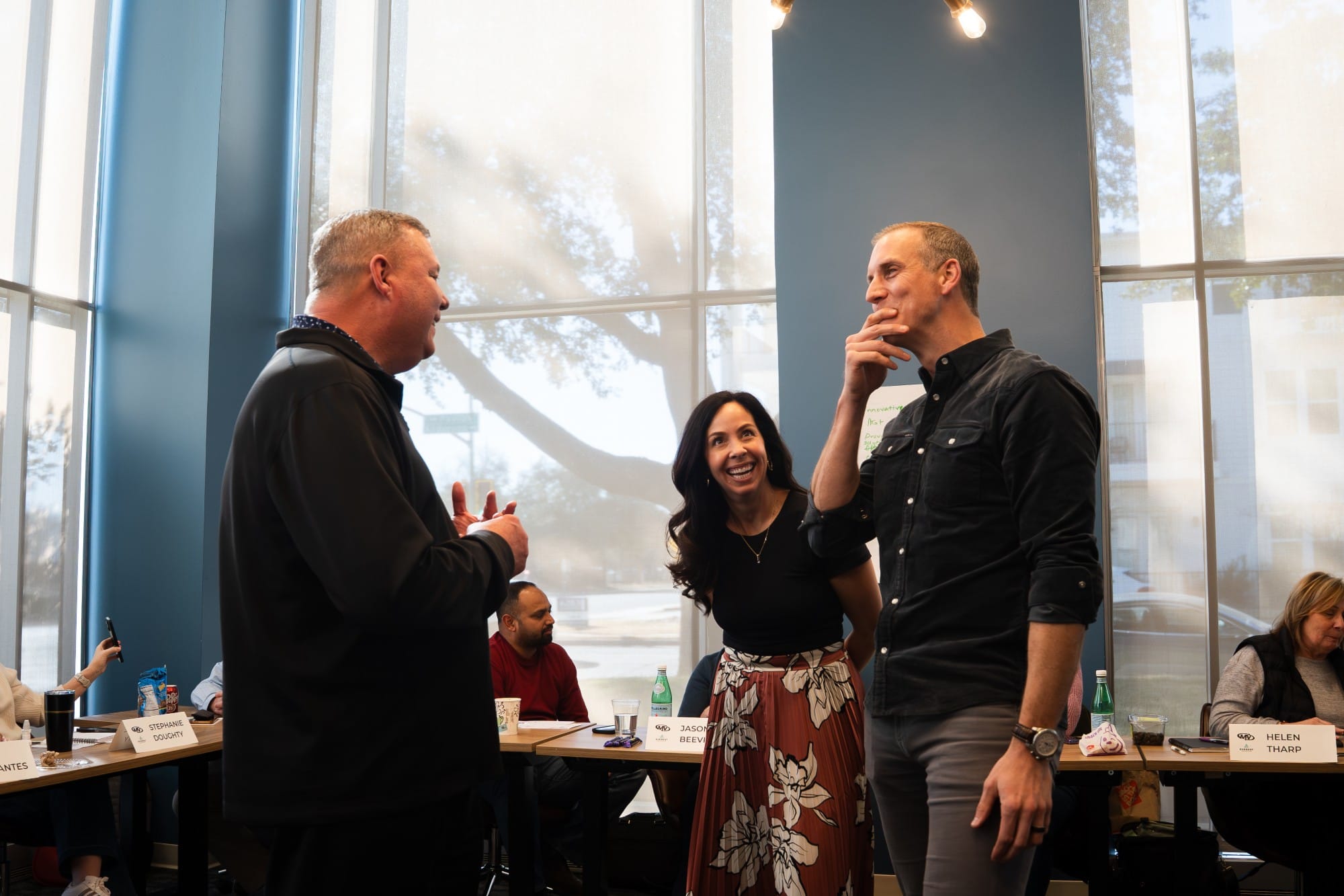 Mike Fromhold and Brittany Tipton laughing with a leader during a session