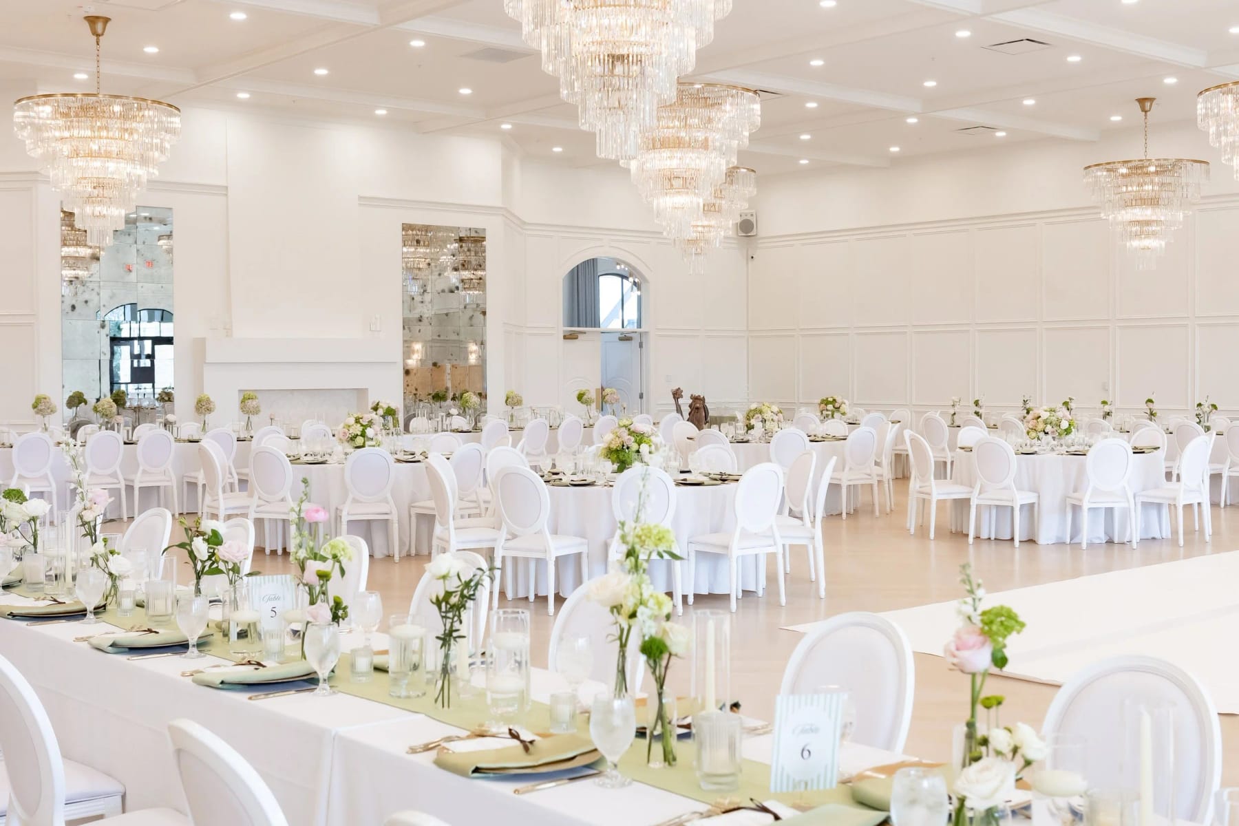 The ballroom at The Reserve at Marty B's, set for dinner under crystal chandeliers