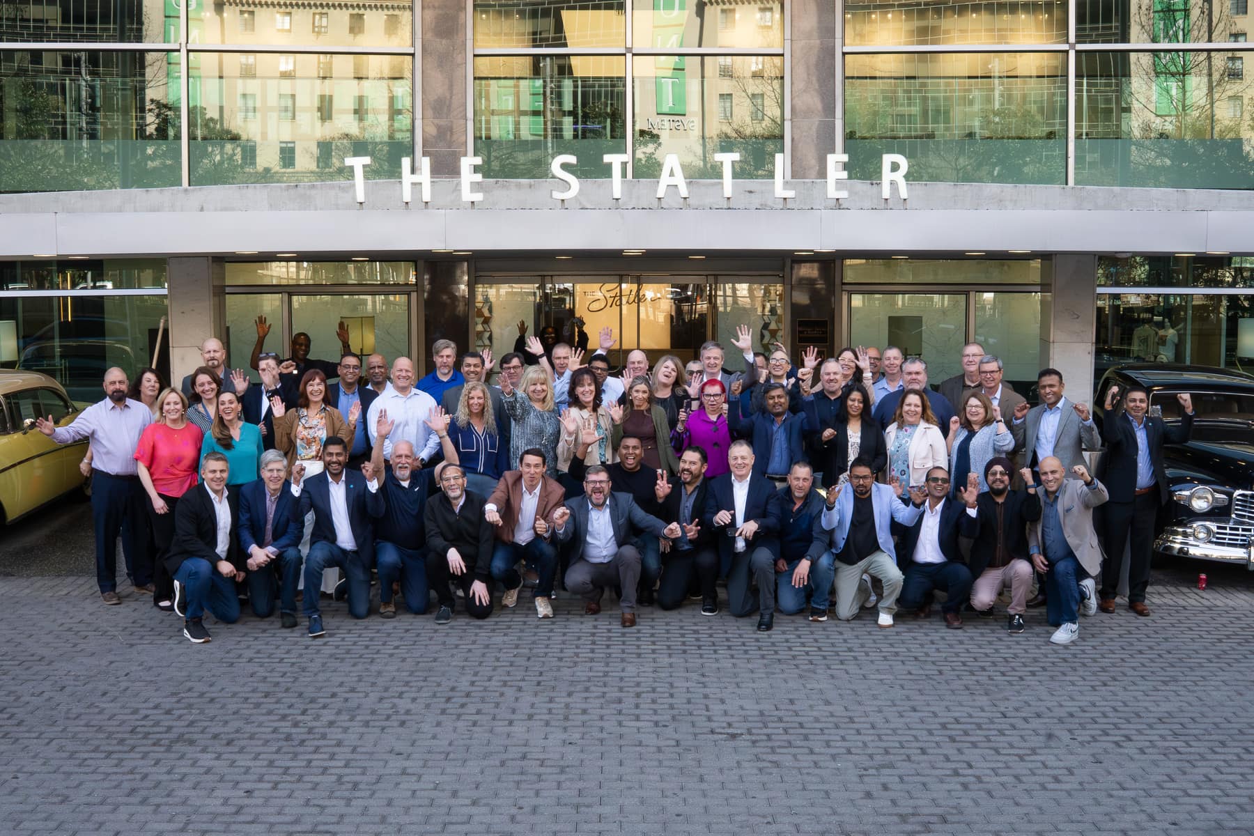 Leaders celebrating outside The Statler in Dallas at a Collective event