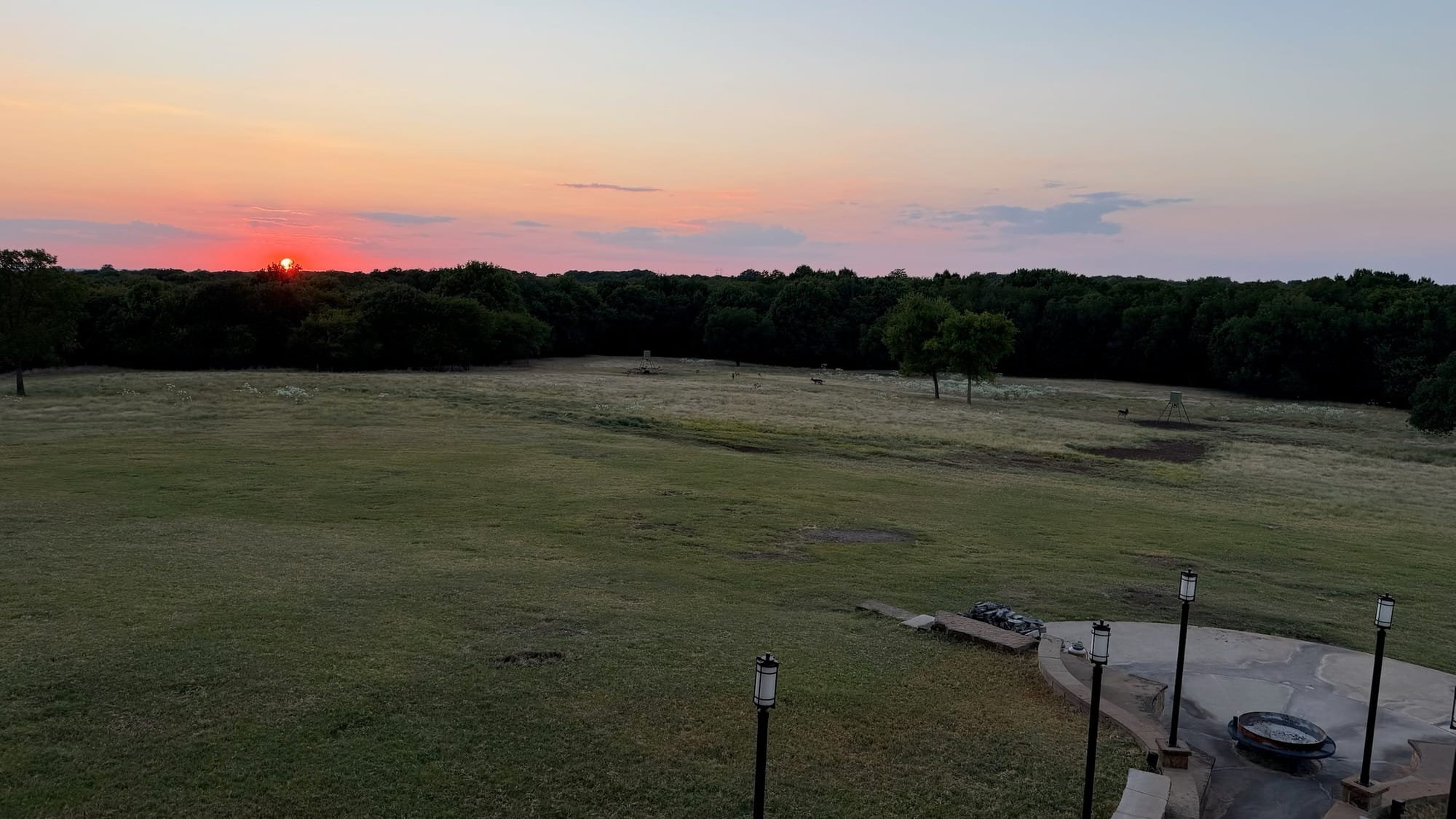 An open Texas ranch field at sundown