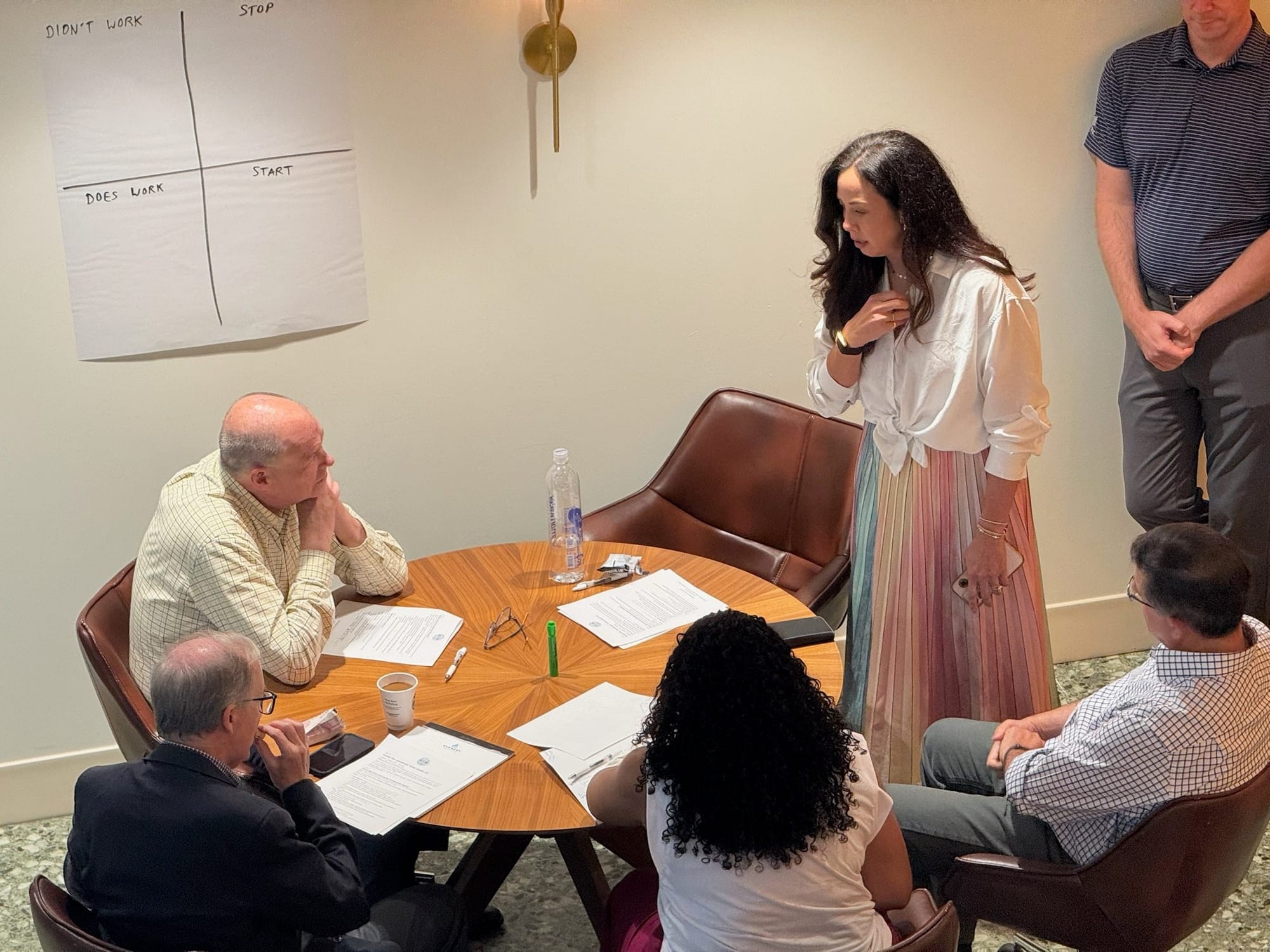 Brittany Tipton coaching a small group at a round table