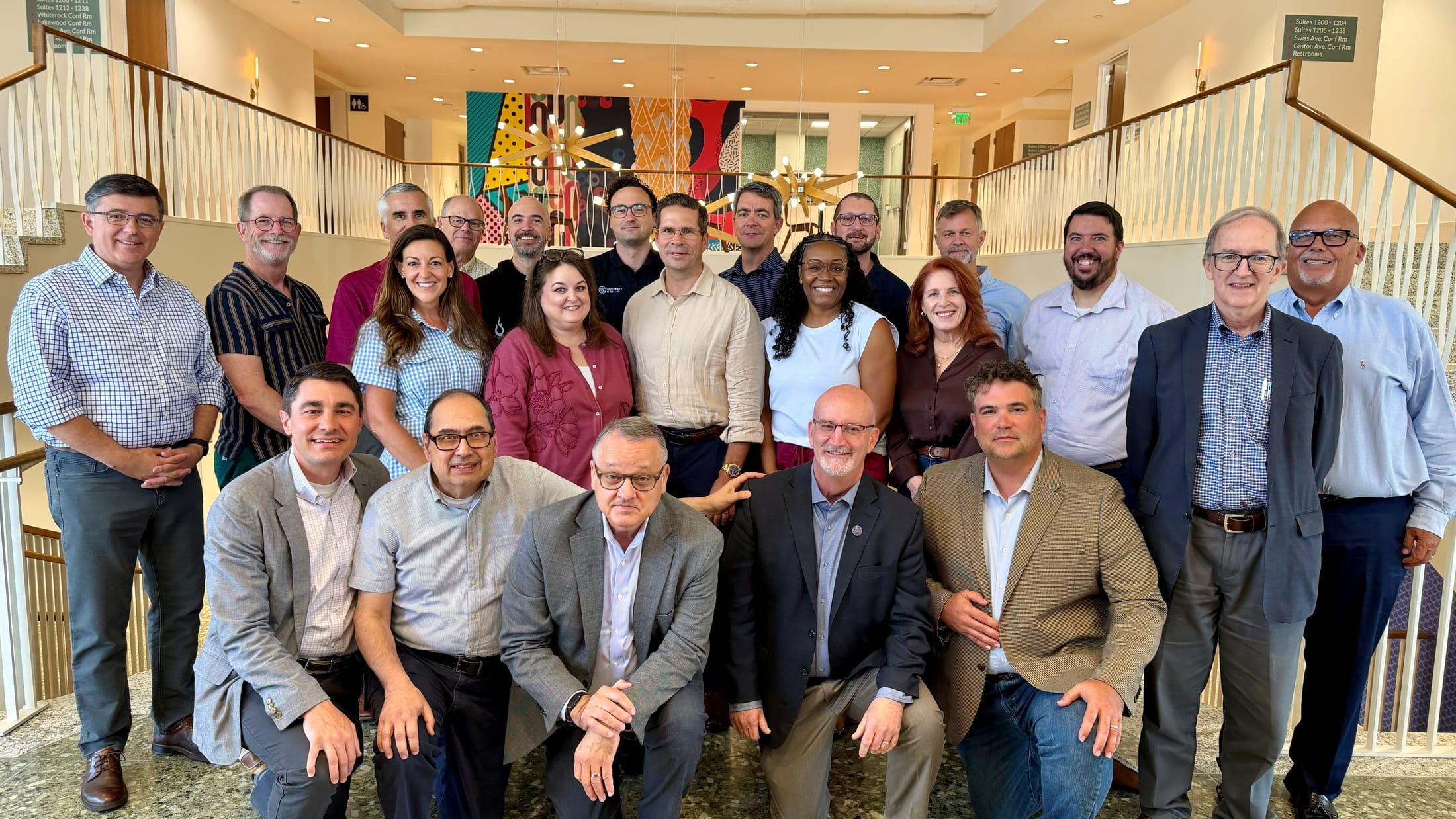 The University of Dallas cabinet together on a staircase at their retreat
