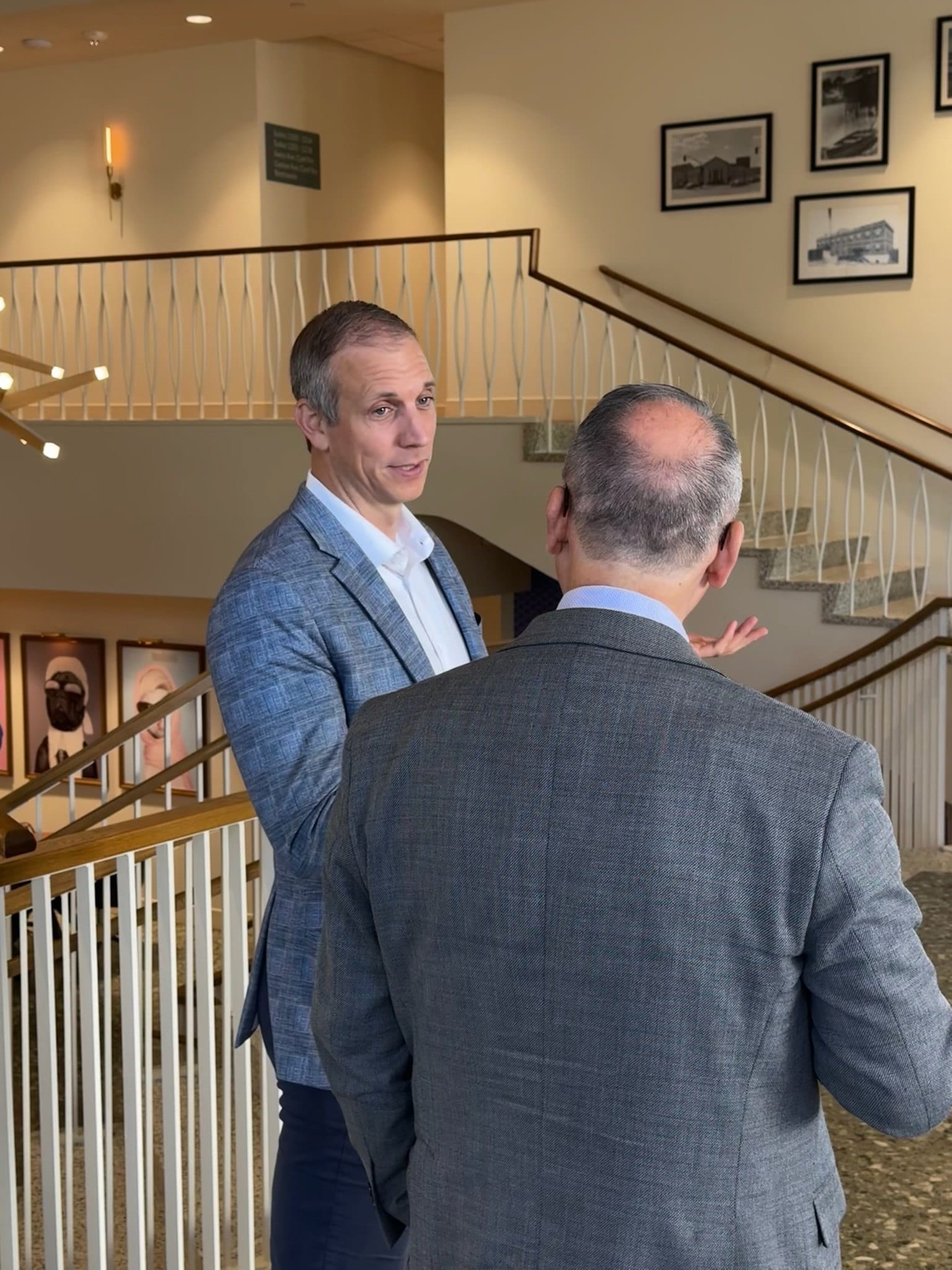 Mike Fromhold in conversation with a cabinet member during a break