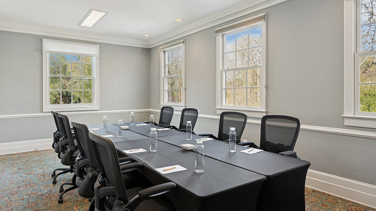 Boardroom with a long table and leather chairs