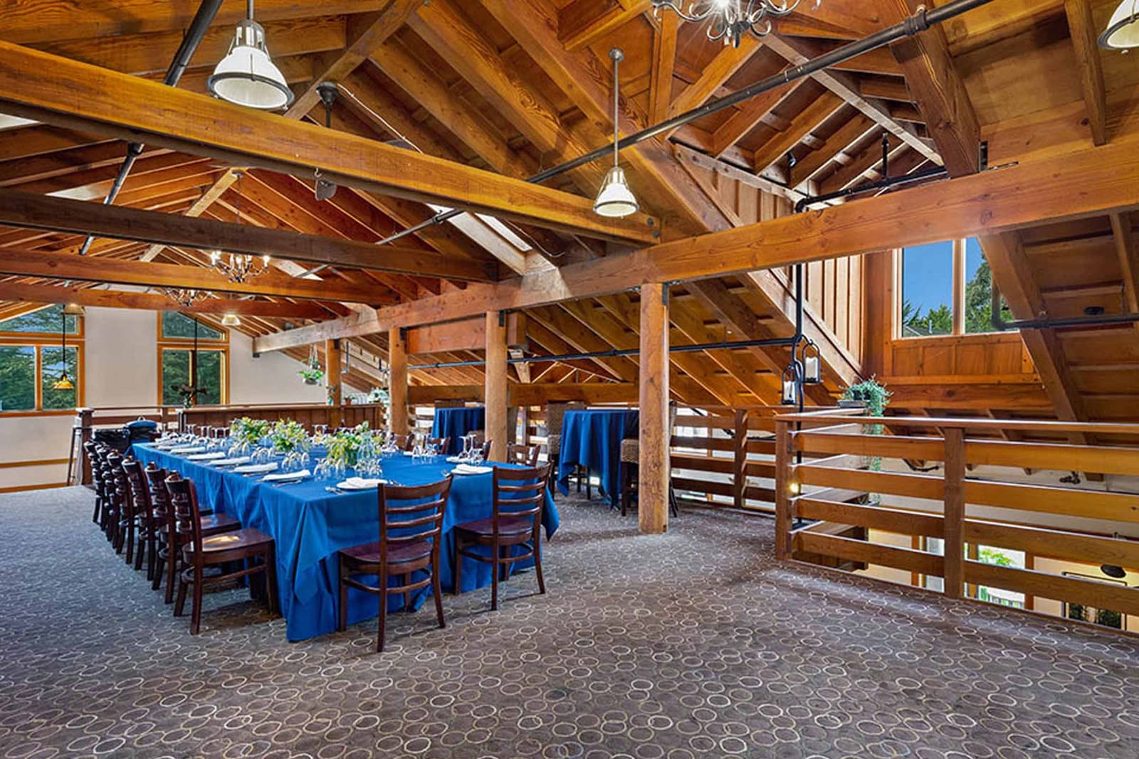 Timber beamed meeting loft set with a long table for a group
