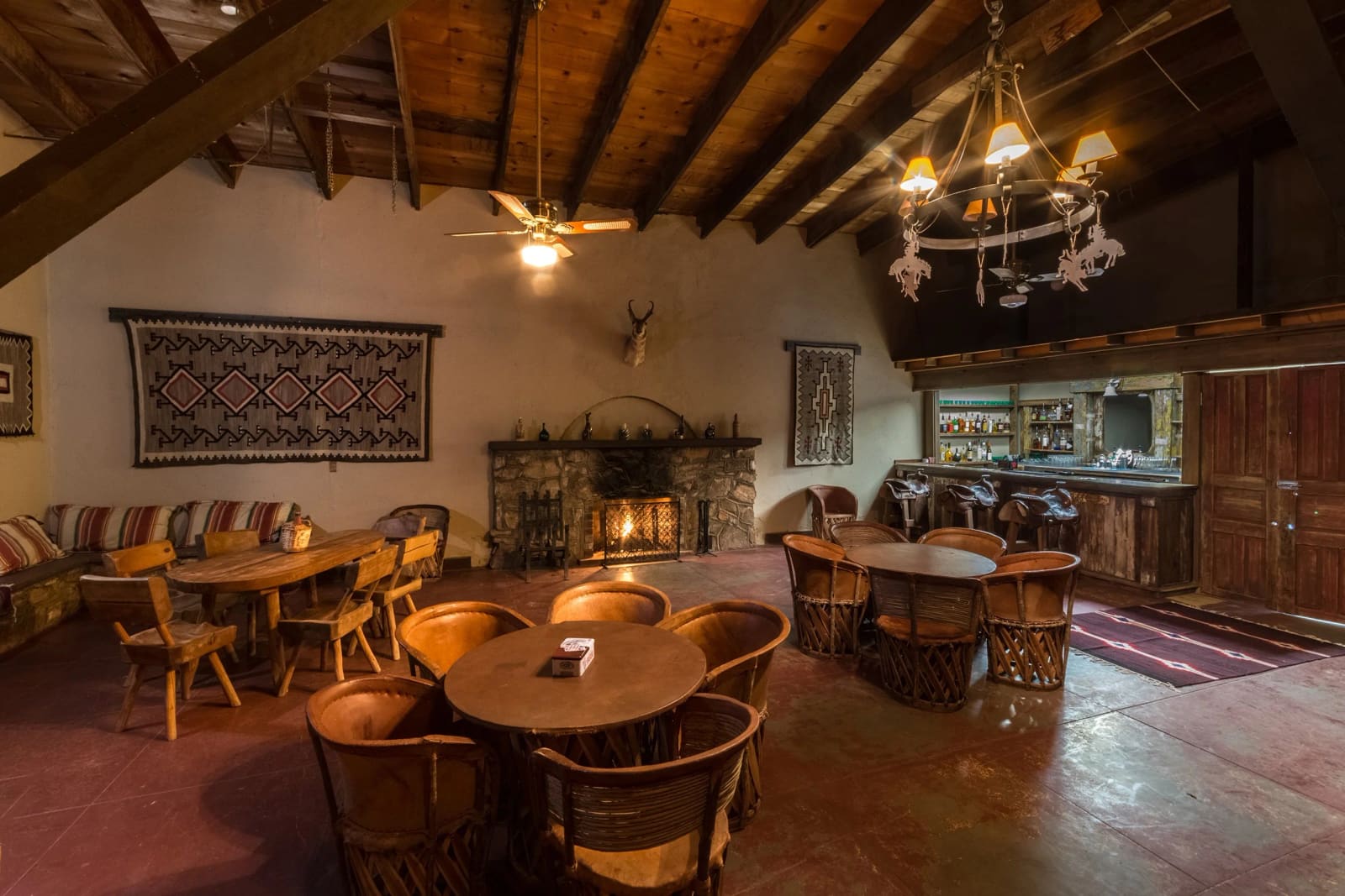 Historic Cantina with beamed ceiling, stone fireplace and bar
