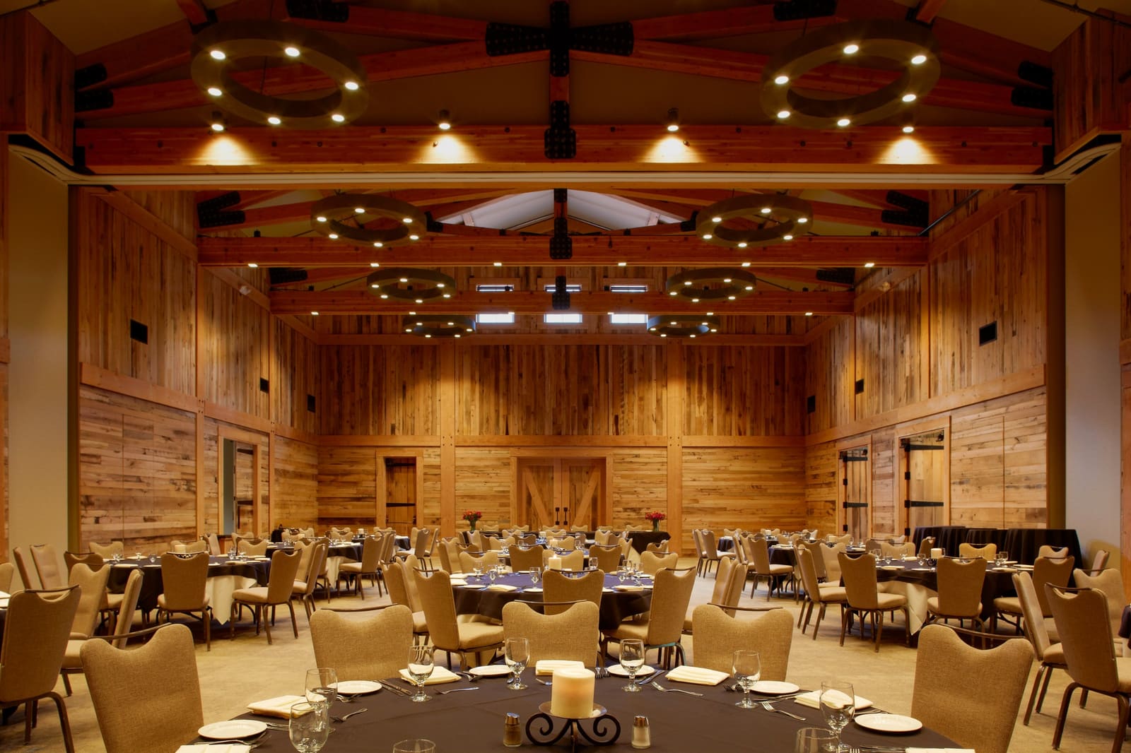 Timber hall of the Redford Conference Center set for a dinner