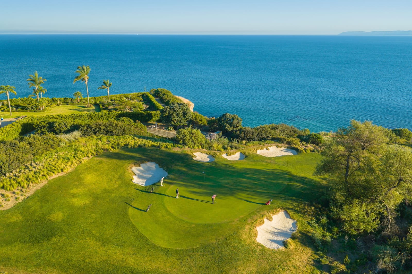 A golf green on a bluff above the Pacific Ocean