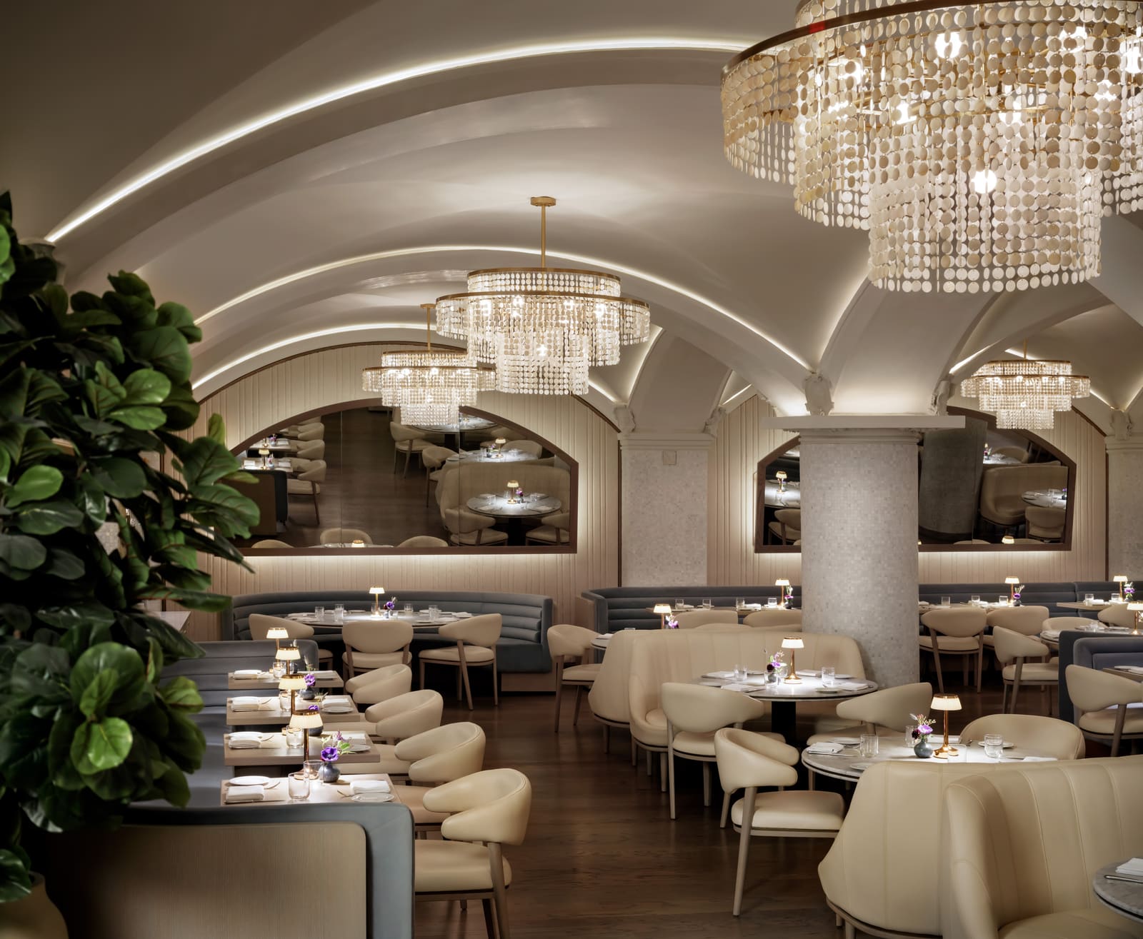Hotel restaurant dining room with vaulted ceiling and chandeliers