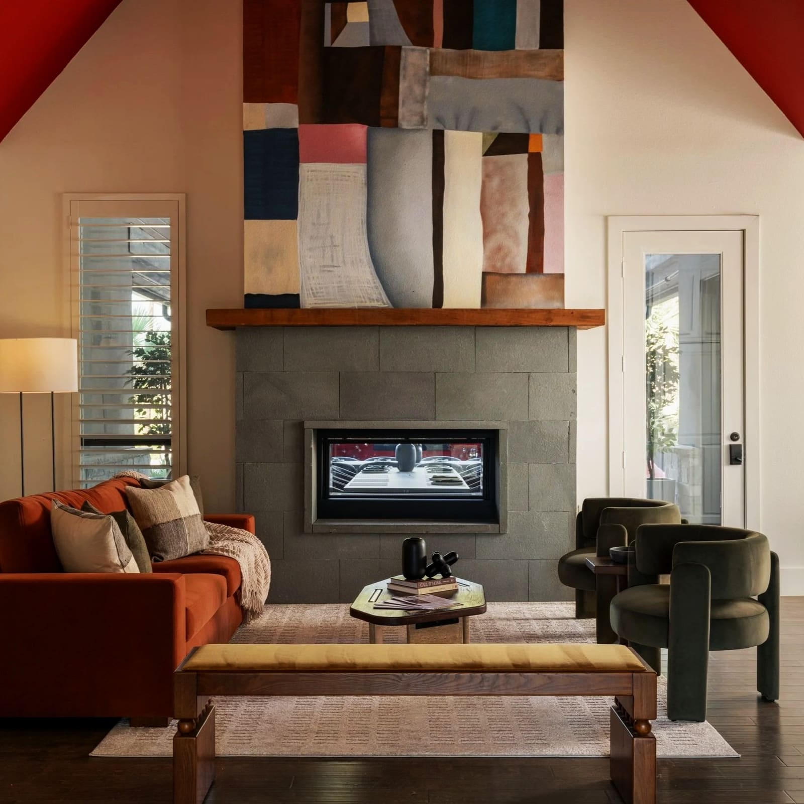 Living room with a vaulted ceiling, fireplace and lounge seating