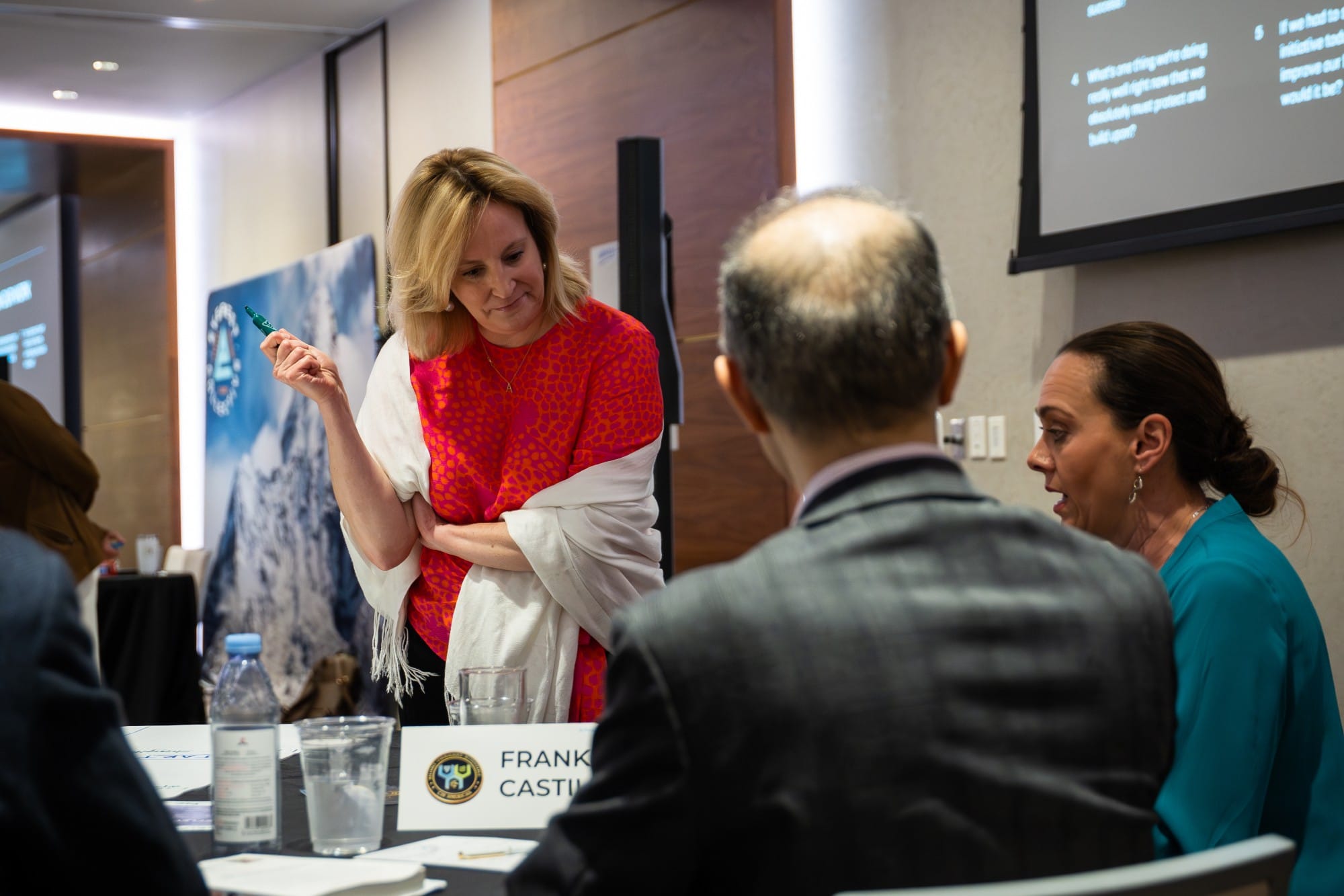 Leaders working through priorities together at a round table